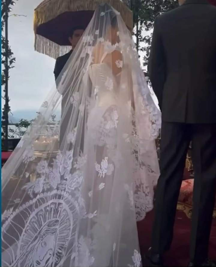 Kourtney Kardashian stuns in a mini dress and a veil with an embroidery of the Virgin Mary as she marries Travis Barker again
