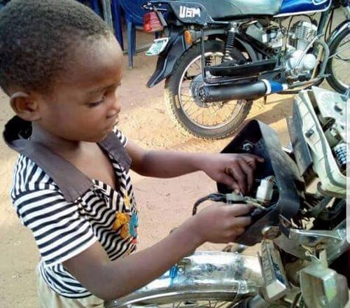 Meet 5-Yr-Old Boy Who Repairs Motorcycles To Pay His School Fees In Benue