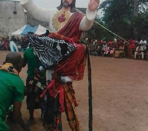 Outrage Sparked As Masquerade Uses Statue Of Jesus Christ For Performance [Photos]