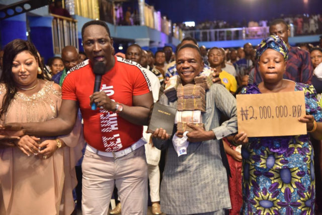 Prophet Jeremiah Omoto Fufeyin Shocks His Members With Lots Of Cash And Cars