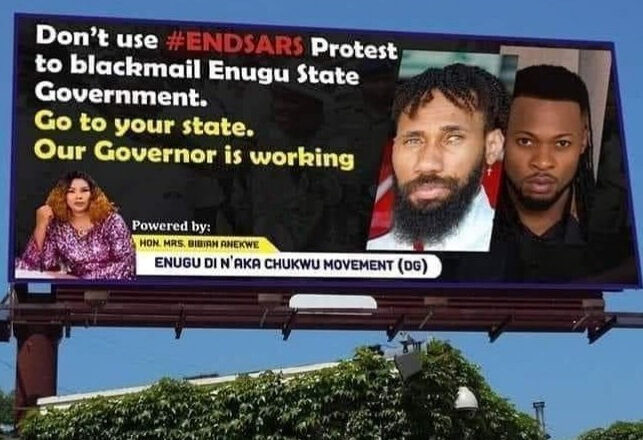 Signpost with Phyno and Flavour's face is put up by Enugu lawmaker accusing them of using End SARS protest to 'blackmail Enugu Government"