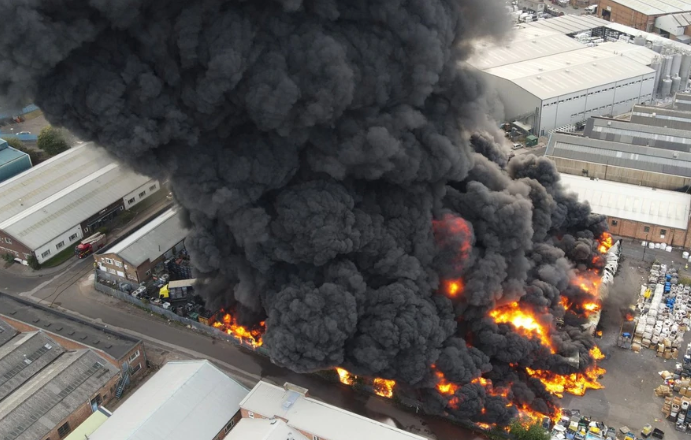 Huge fire breaks out in Birmingham and over 100 firefighters battle to put it out (video)