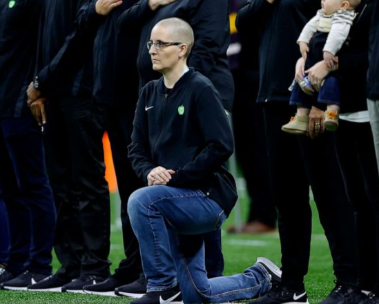 At college football championship attended by President Trump, ‘Teacher of the Year’ takes a knee during national anthem
