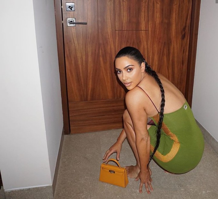 Kim Kardashian celebrates 170 Million Instagram followers by releasing new photos of her in a figure hugging, cleavage-baring, low-cut dress