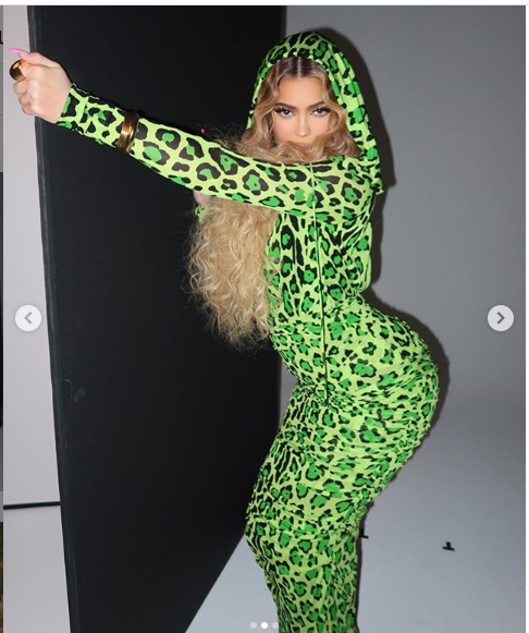 Kylie Jenner strikes suggestive poses in a neon green leopard print dress (Photos)