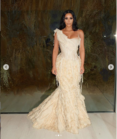 Kim Kardashian stuns in extravagant gown as she attends the Oscars after-party with husband Kanye West (Photos)