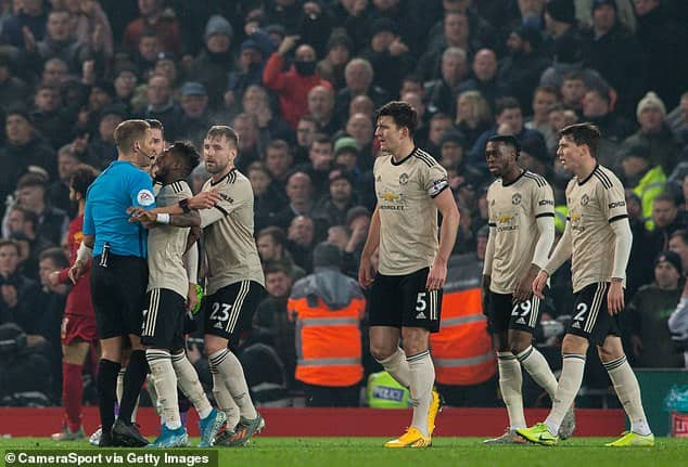  Manchester United hit with FA charge for surrounding referee Craig Pawson during Liverpool clash