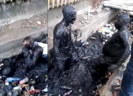 Video: Two Men Engage in Serious Fight Inside a Gutter Over N100