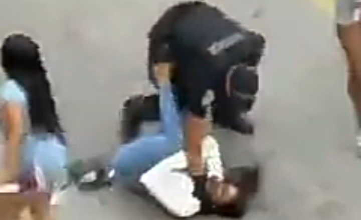 Miami police officer is seen attacking and choking a woman after she mistakenly bumped into him (video)