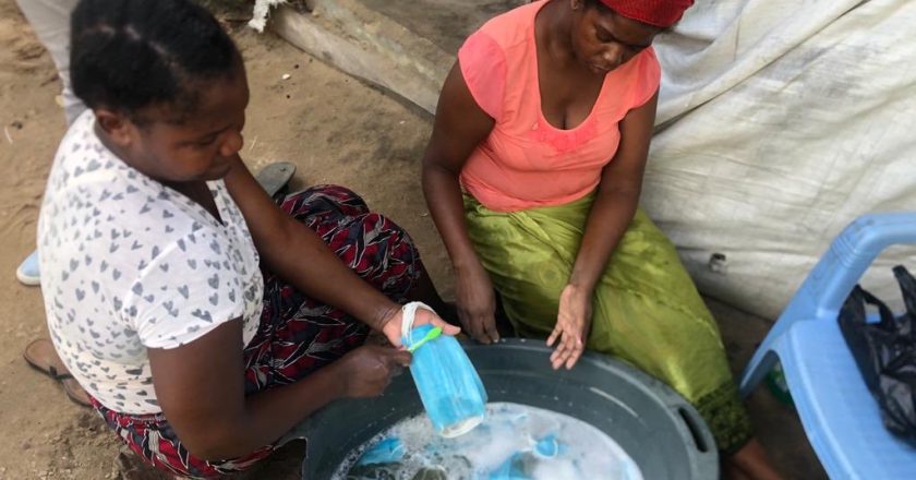 Mozambican women caught washing used facemasks to resell (photos)