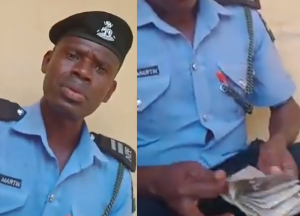 Police officer caught on video counting money after "extorting" 40,000 from a man has been arrested (Watch video)