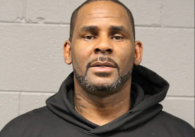 <html>
  <body>
    R. Kelly’s Legal Meetings Disrupted by Coronavirus