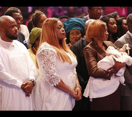 Sinach and her spouse dedicate their baby during mid-week church service
