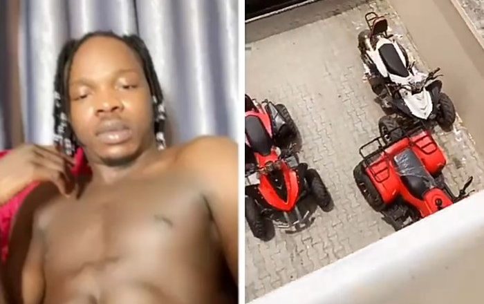 "Do you want all or some? Naira Marley asks as he teases fans with his abs and quad bikes (video)