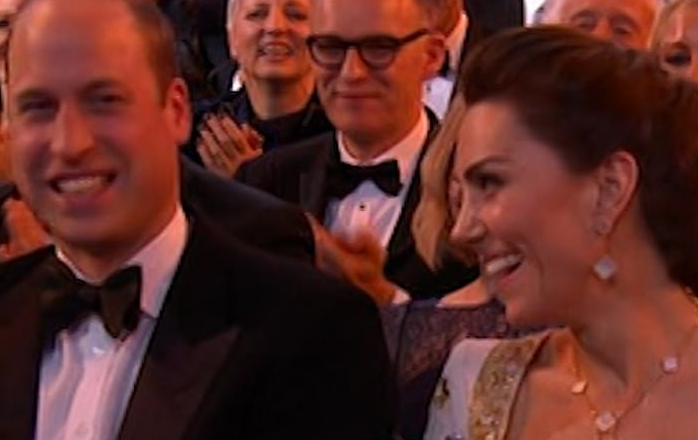 "I'm naming this award Harry, because it's coming back to the US with me!' Prince William and Kate Middleton laugh awkwardly at Brad Pitt's joke at the BAFTAs