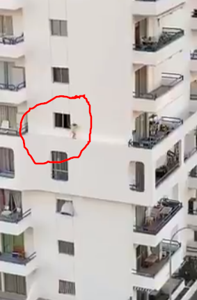 Watch the terrifying moment a toddler climbs out of fifth floor apartment window and stumbles along ledge in Tenerife