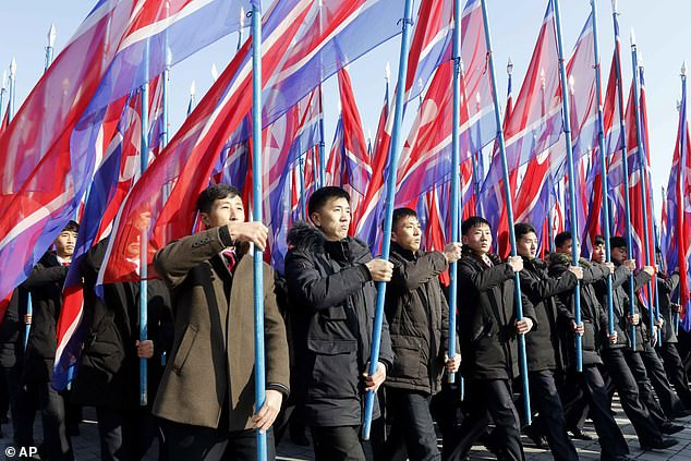 <html>
Support for Kim Jong Un’s Threats to Create ‘New Strategic Weapon’ Grows at Mass Rally in North Korea amid Stalled Nuclear Talks with US (photos)