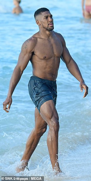 Anthony Joshua shows off his muscular physique during beach day in Barbados (Photos)