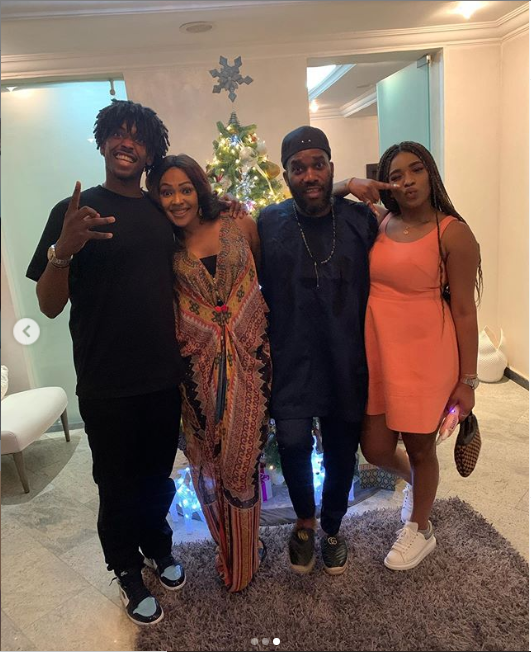 Nigerian football legend Jay-Jay Okocha poses with his wife and children for New Year