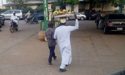 Photo of a visually impaired man who sells banana in Kaduna to pay bills and train his children in school