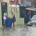 Lagos identifies residents disposing trash in flood water, locks building