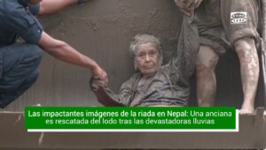The dramatic rescue of an elderly woman trapped in the mud after the Nepal floods