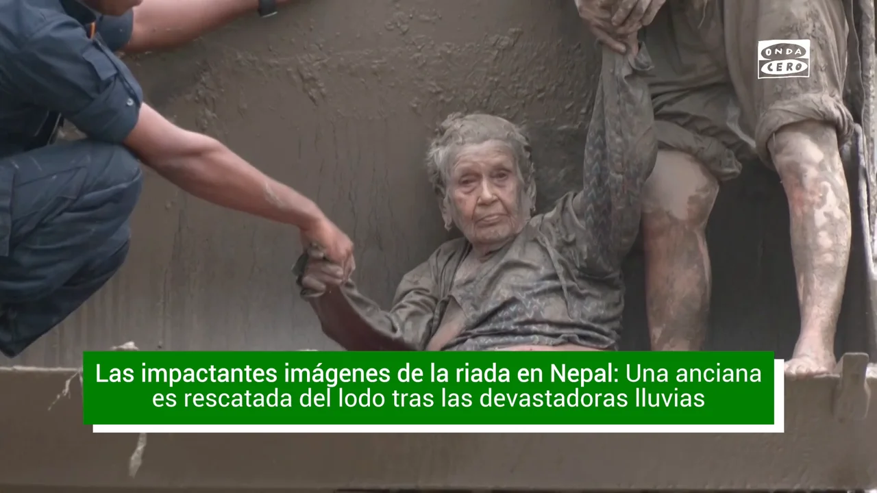The dramatic rescue of an elderly woman trapped in the mud after the Nepal floods